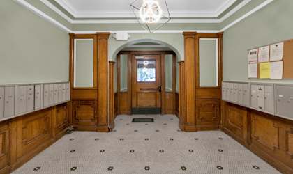 A room with wooden doors and a tiled floor.