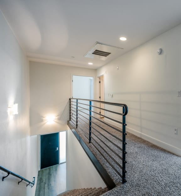 a view of the top of a staircase in a new home