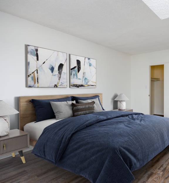 a bedroom with a bed and a desk with a chair