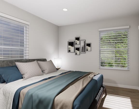 a bedroom with a bed and two windows