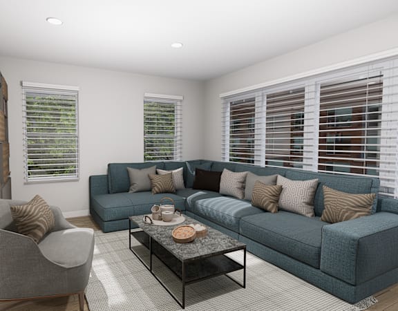 a living room with a blue couch and a coffee table