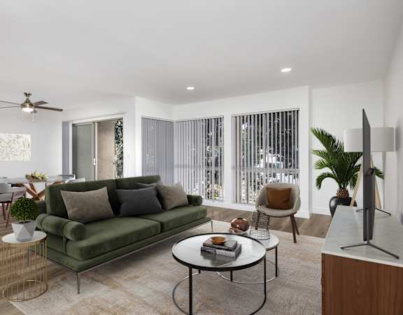 a living room with a green couch and a table