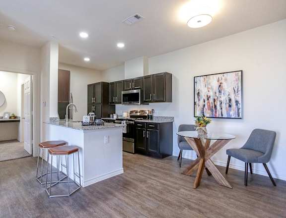 a kitchen and dining area in a 555 waverly unit