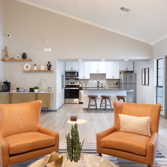 a kitchen with a stainless steel refrigerator freezer and stove top oven