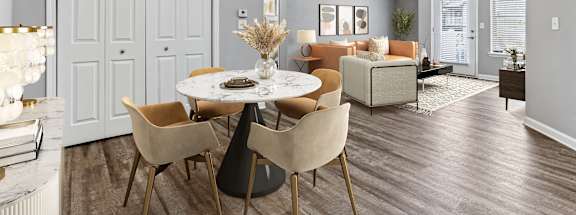 an open living room and dining room with a table and chairs