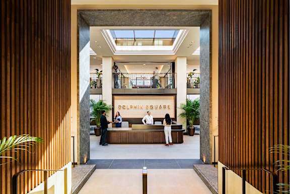 A reception area with a sign that says "Dublin Square".