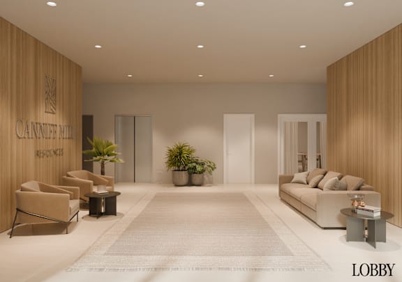 A modern living room with a large couch, chairs, and a coffee table.