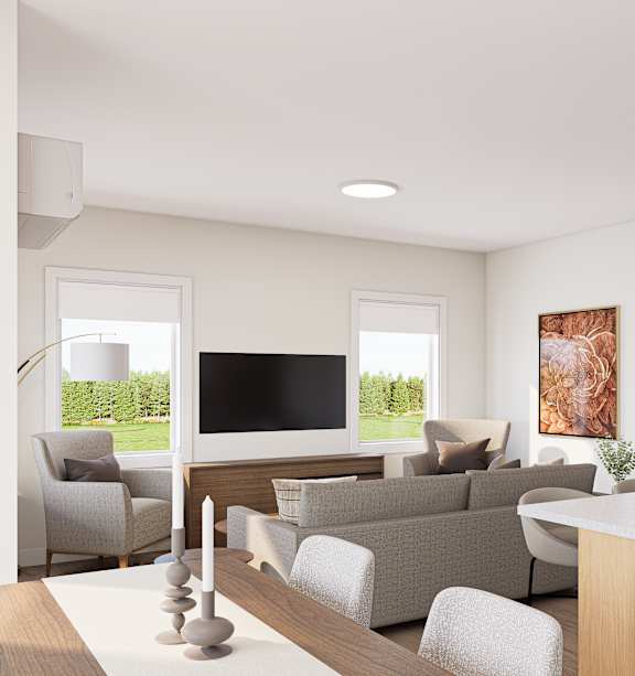 A modern living room with a large window and a kitchen area.