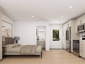 A modern bedroom with a bed, nightstand, and a kitchen area with appliances.
