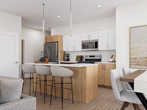 A modern kitchen with wooden cabinets and a bar area.