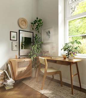 A room with a desk, chair, and a window with a view of trees.