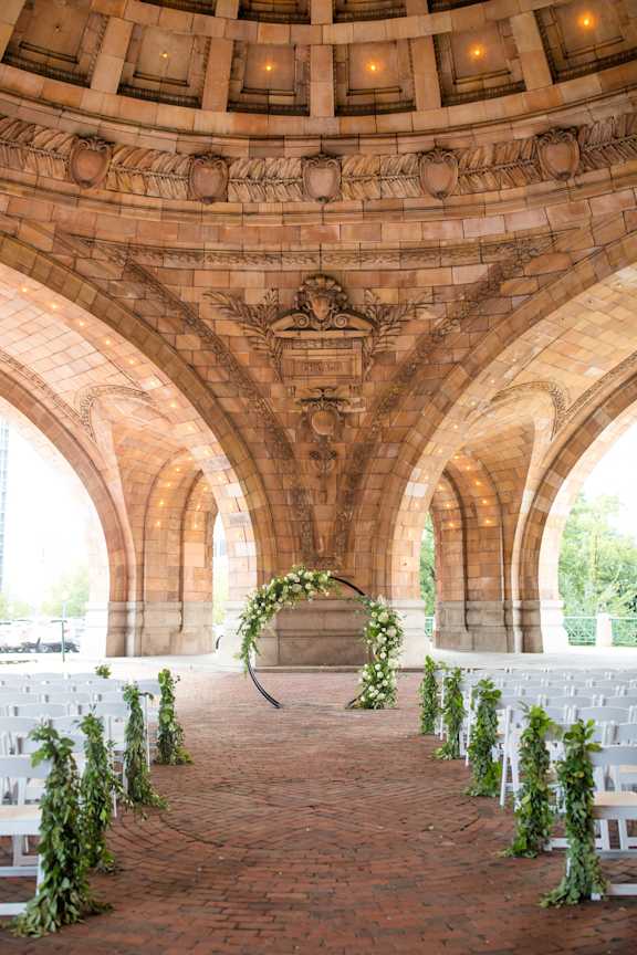 A wedding ceremony is taking place in a beautiful arched stone building. at The Pennsylvanian Apartments, Pittsburgh, Pennsylvania