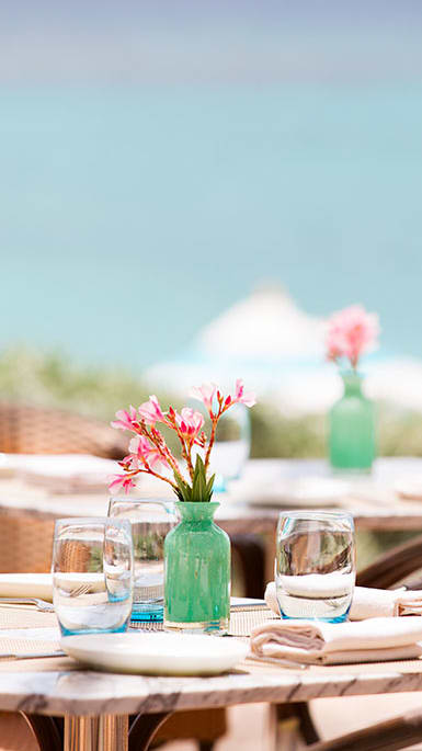 Restaurant table outside near water at Bernwood Trace Apartments, Florida