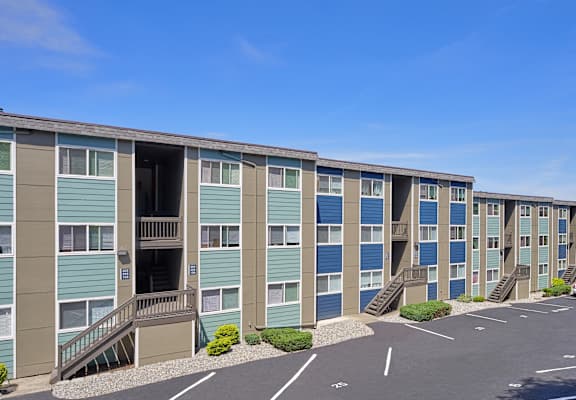 A parking lot in front of a row of apartments in Renton, WA at Peak 88.
