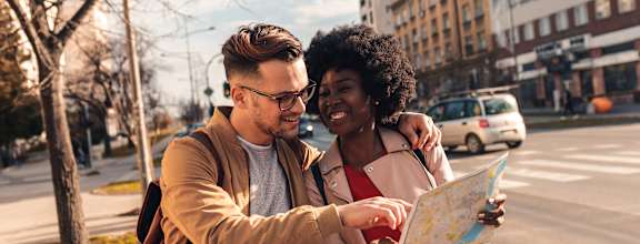 A man and woman are looking at a map together.