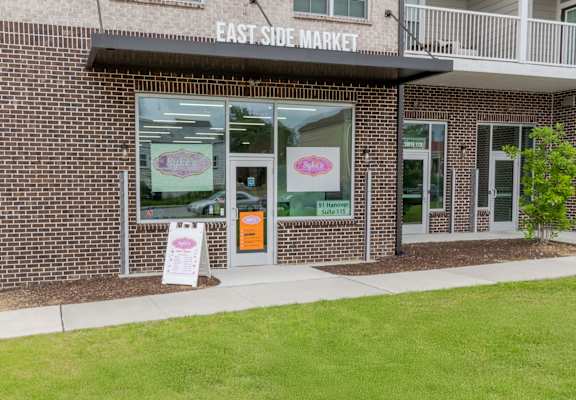 A brick building with a sign that says East Side Market.