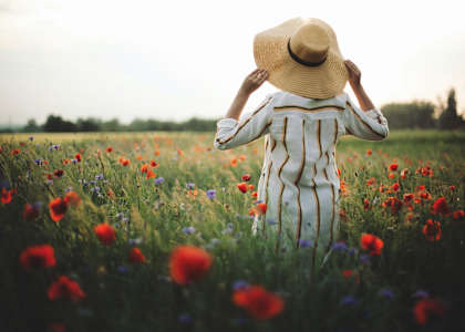a woman in a field of flowers