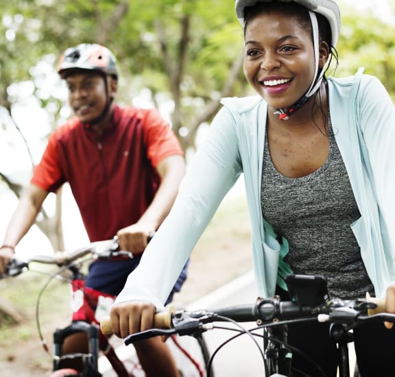 a woman and a man riding bikes