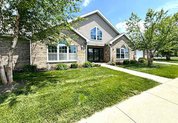 the front of a house with a lawn and trees at Hawthorne Properties in Lafayette, IN 47905