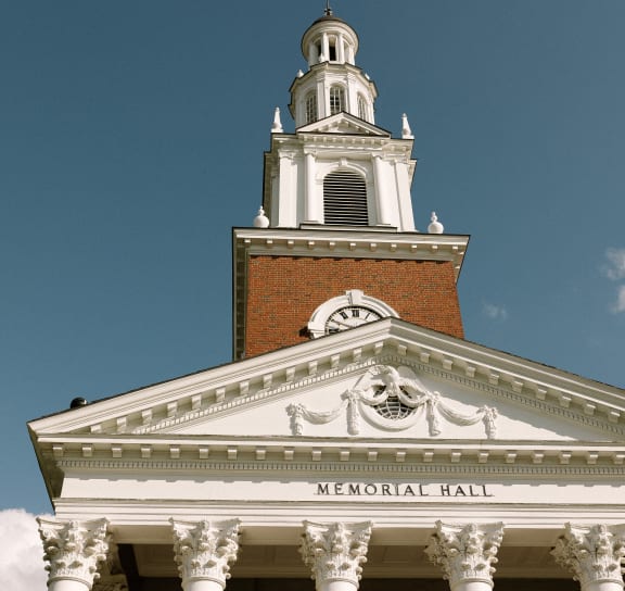 a building with a steeple and a clock on top of it