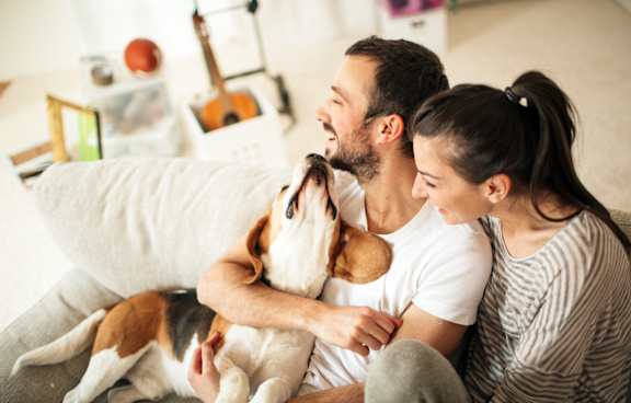 a family sitting on a couch with their children
