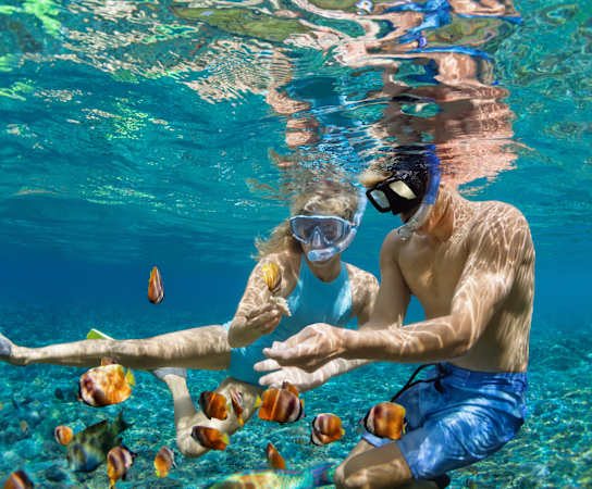 a couple snorkeling in the ocean at Lakes at Suntree, Melbourne, Florida