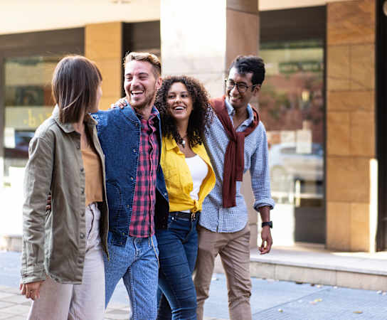 a group of people walking down the street at Residences at Manchester Place, Manchester