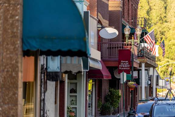 A street view of Main Street with a car parked on the side.