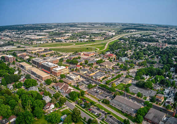A bird's eye view of a city with a large building in the center.