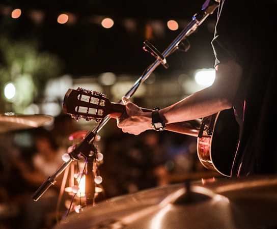 person playing a drum set at night at Glenwood at Grant Park Apartments, Atlanta, 30316