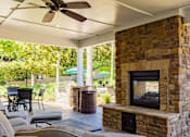 Thumbnail 11 of 40 - Outdoor Fireplace at Stone Ridge Apartment Homes, Mobile, AL