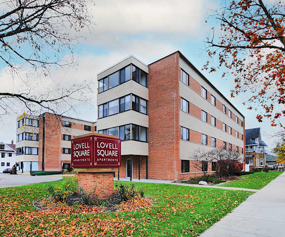 A brick building with a sign that says Lovell Square.