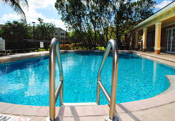 a swimming pool at a hotel with a resort style pool at Sanctuary Cove, North Lauderdale, 33068