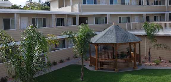 a gazebo in the courtyard of a building
