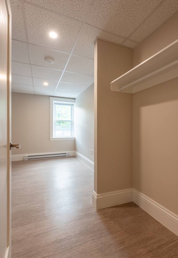A room with a window and a door.