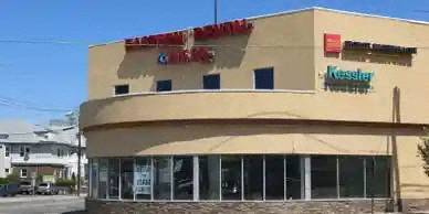 the front of a building with a sign on top of it
