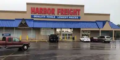 the front of a building with a sign on top of it