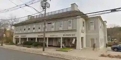 an old building on the corner of a street