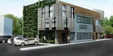an image of a building with cars parked in front of it
