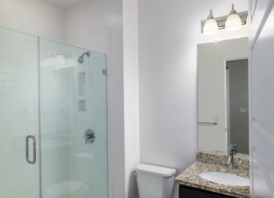Bathroom with frameless shower at Leo  at Waterfront Station in the Southwest Waterfront neighborhood in SW, Washington, DC 20024