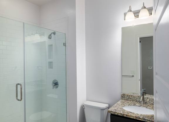 Bathroom with frameless shower at Leo  at Waterfront Station in the Southwest Waterfront neighborhood in SW, Washington, DC 20024