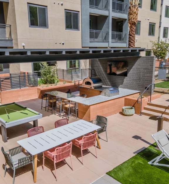 Aura Central Apartments Outdoor Courtyard with BBQ Grill and Pool Table