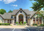 Thumbnail 38 of 40 - A large house with a stone facade and a large front door.