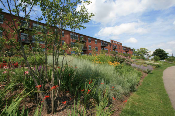 a garden in front of a building  at Hayden Lofts Apartments, Dublin, OH 43016