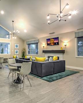 A modern kitchen with a dining table set for four.