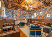Thumbnail 13 of 24 - A room with a wooden floor and a blue carpet.