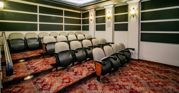 a conference room with a red carpet and chairs