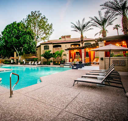 a swimming pool at night at the resort at turf