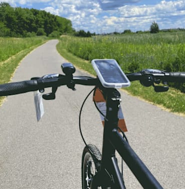 a bike is parked on the side of a trail