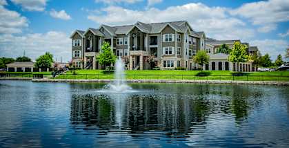 Views of On-Site Lake with a Water Fountain at Houston Apartments 77077